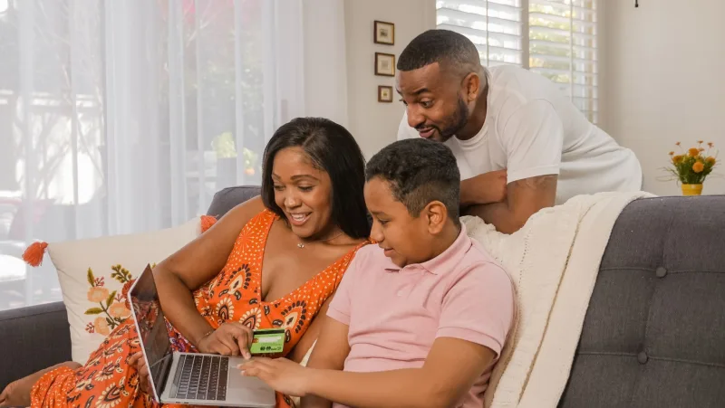 family using laptop